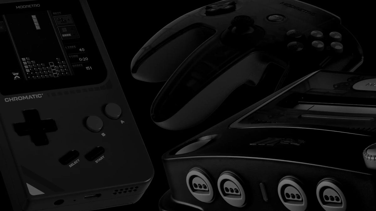 A ModRetro Chromatic handheld, controller and console arranged in low light